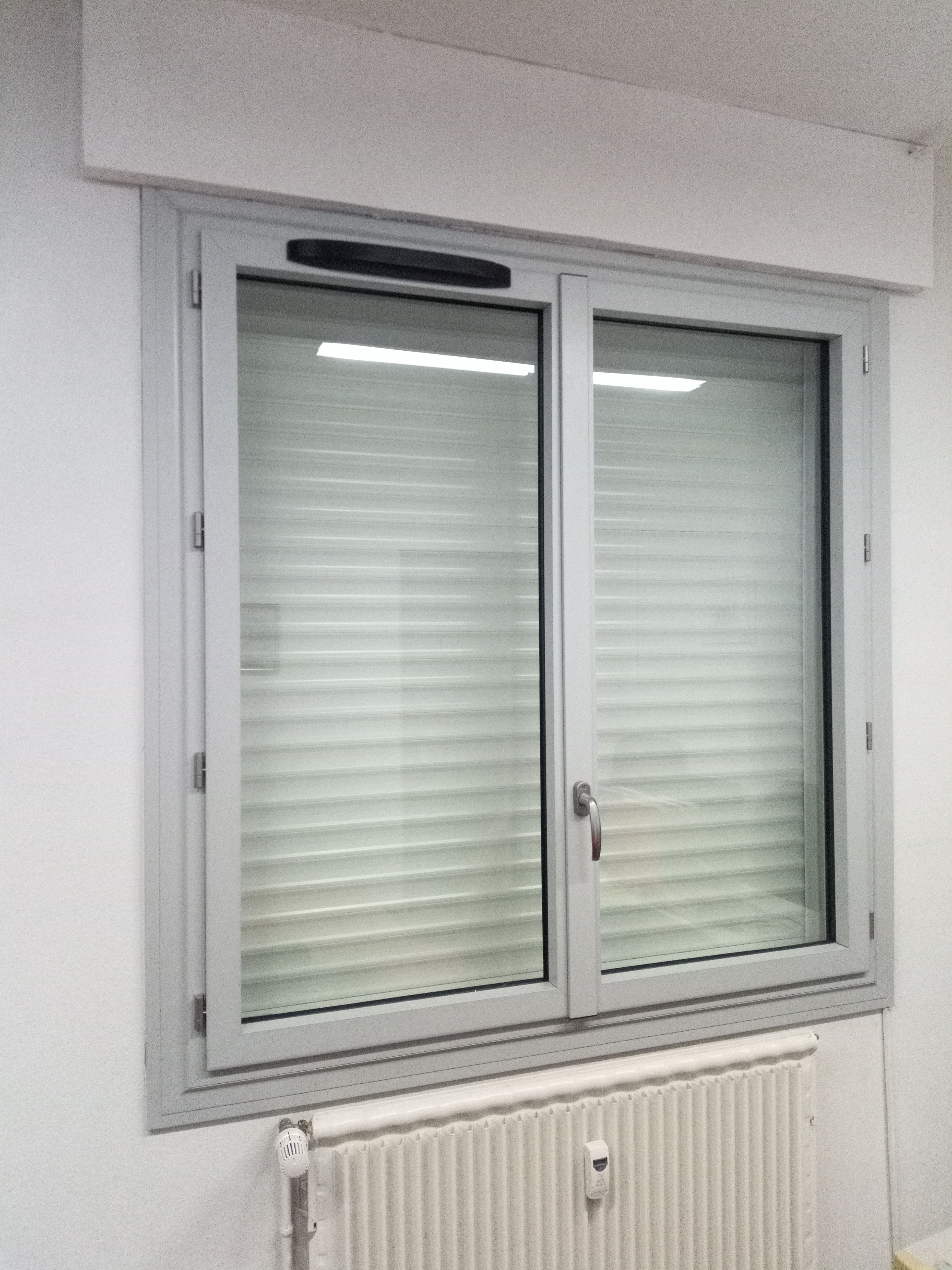 Installation persiennes artisan bois